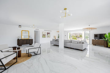 Spacious modern living room with minimalist furniture and marble floors
