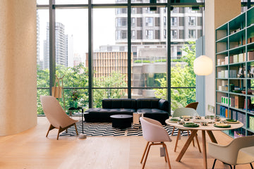 Modern living room with large windows and city view